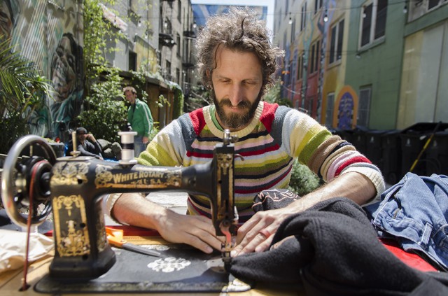 Michael Swaine mends clothing of locals in the Tenderloin National Forest the afternoon of April 15, 2012. Swaine comes out once a month and offers his services to mend clothing for anyone who needs it. Photo by Gil Riego Jr.