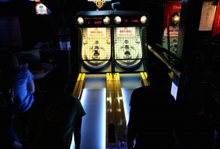 Myra Navarro (left), of Fighting Falangees Balls of Fury, and Chris Chang, of ASTRO Ballers, play each other during a skeeball match at Bar None, in San Francisco, Monday, Feb. 20th, 2014.
Photo by Gavin McIntyre / Xpress