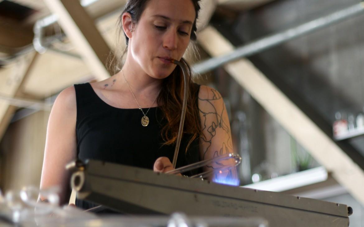 Neon Artist Meryl Pataky works on a glass tube that will be used for an upcoming piece. (Gavin McIntyre / Xpress Magazine)