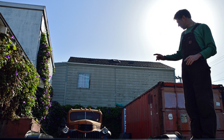 Future tiny house builder, Alain Despatie stands on his trailer where his tiny home will be built in West Oakland. (Katie Lewellyn)