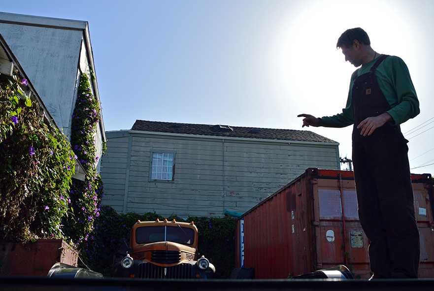 Future tiny house builder, Alain Despatie stands on his trailer where his tiny home will be built in West Oakland. (Katie Lewellyn)
