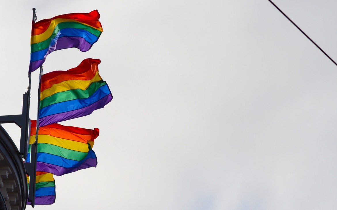 Four pride flags fly high over the Castro neighborhood July, 26 2015. Peter Snarr/ Xpress