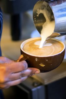 Belen G.yesus pours a latte at Zo11 Coffee roasters in San Francisco's Fillmore District on March 23, 2016
