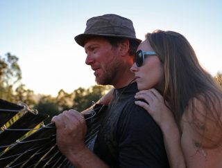 Bryon Kaufman and his partner, Miranda Olds, look at was used to be their backyard on Yerba Buena Island on Sunday Sept. 18, 2016. Their backyard used to have a garden with various plants, fruits and vegetables along with a forty-foot Slip N' Slide that started from their second floor deck. (Aleah Fajardo/ Xpress)