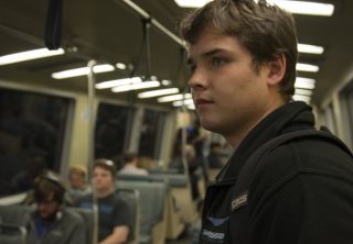 Jake Richard stands on the BART during an hour-long ride to his home in Puttsburg, Calif. on Tuesday, Sept. 13, 2016.