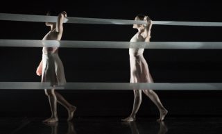 Kaneisee Collective's dancers walk in to the stage at the begining of the