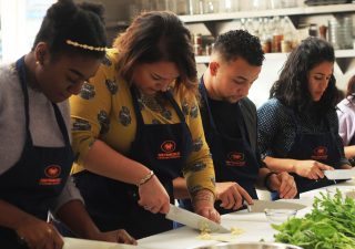 GSP students Zemaye Jacobs and Joel Martin-Dill join GSP caseworker Melanie Ramirez-Carpio during a cooking class at the San Francisco Cooking School on Monday, Oct. 10, 2016. Recently, the program added a few new events, like the Cooking Project Event to create student bonding.
