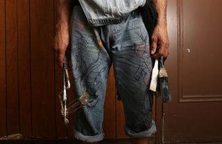 Ronnie Goodman with his paint brushes. Aleah Fajardo/ Xpress