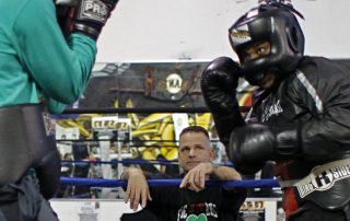 Jimmy Ford watches as two fighters spar at Fire in the Ring Boxing Gym on Wednesday October 5, 2016. Fire in the Ring which was founded by Jimmy Ford provides a free after school program for the youth in order to provide a safe environment. Connor Hunt // Xpress Magazine