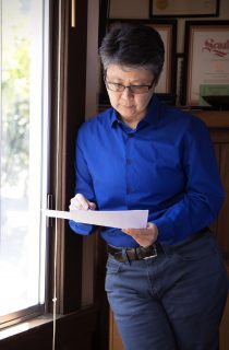 Madeleine Lim reviews a grant proposal to the Center for Asian American Media in the QWOCMAP office in the Richmond District in San Francisco. She is trying to fund a documentary project. Steven Ho // Xpress Magazine