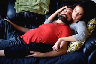 Rosalie Del Toro gently strokes Yoni Alkan's arm during their cuddle session. According to Alkan, hands are a big part of cuddling. They offer a simple yet effective feeling of comfort. (Eric Chan / Xpress)