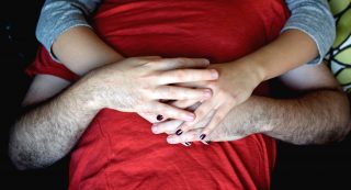 Yoni Alkan and Rosalie Del Toro demonstrate different ways to incorporate hands into cuddling sessions on Saturday, November 5, 2016. Alkan is a professional cuddler who offers non-sexual and therapeutic sessions at his private cuddle space in the Richmond District. (Eric Chan / Xpress)