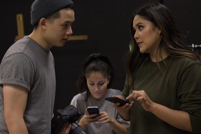 Photographer David Ho (left) talks with make-up artists Sarah Espinoza (right) while stylist Allison Caragena (center) looks at her phone at San Jose State University on Sunday Nov. 28, 2016. Brenna Cruz/Xpress