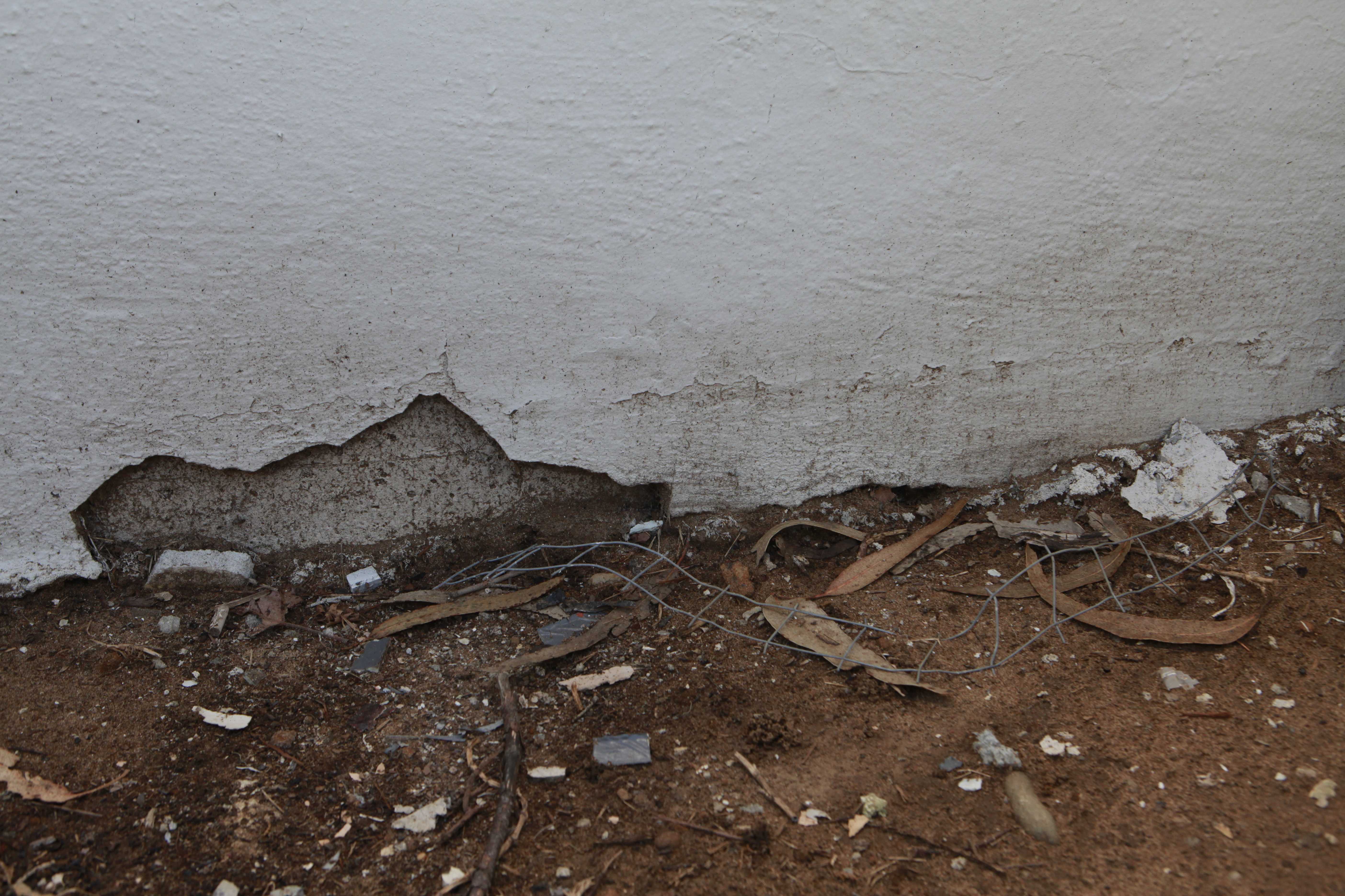 Crumbling walls and wiring can be found laying near the lower portion of University Park North. Photo By Garrick Wong