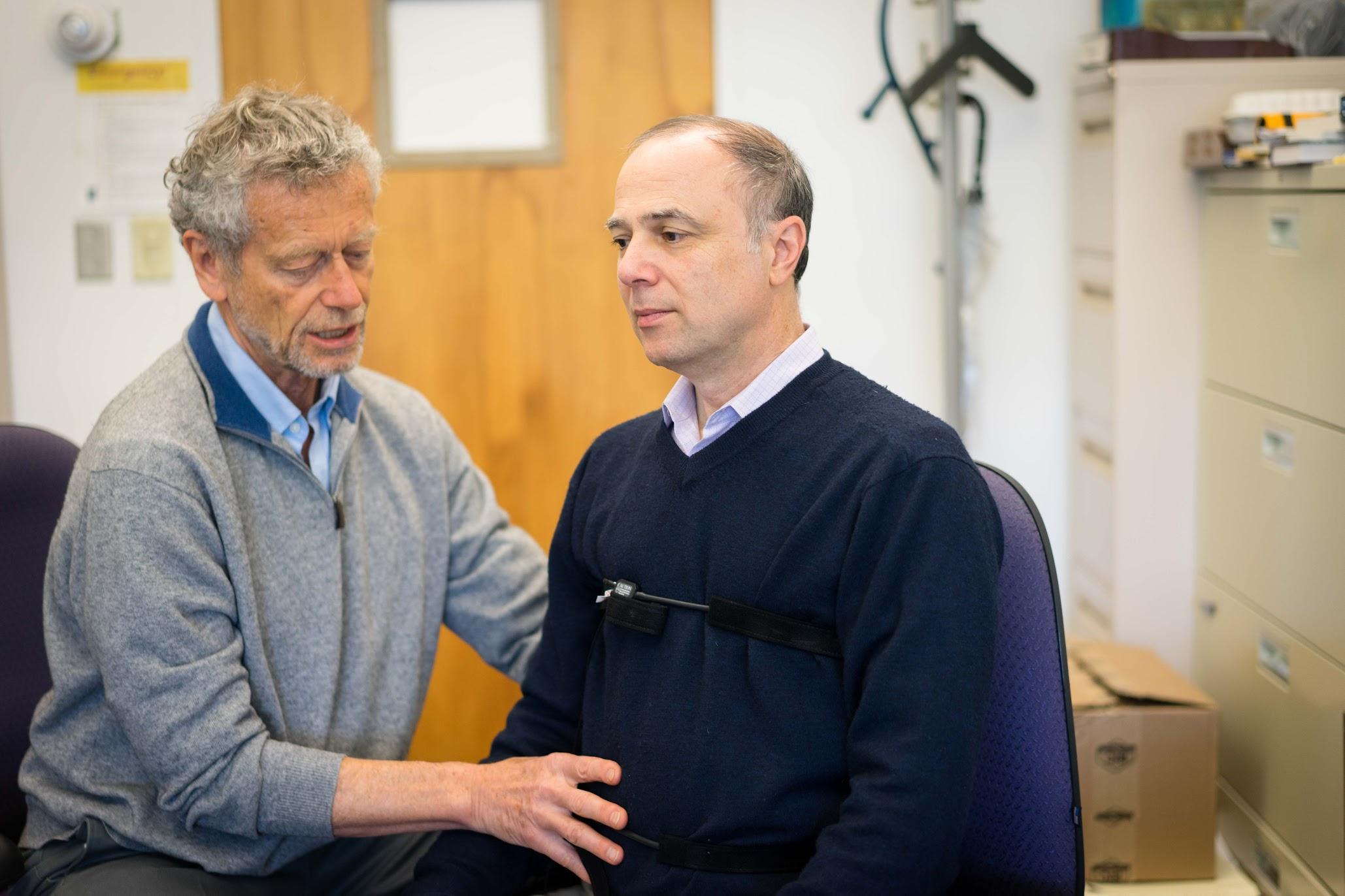 Professors Erik Perper and Richard Harvey demonstrate breathing techniques in the Humanities Building at SF State on Monday, April 17, 2017 (Sarahbeth Maney).