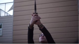Co-Founder of the SFSU Occult club, Shea Bile, holds ceremonial dagger during a protection ritual against Donald Trump in San Francisco on Sunday, April 30, 2017.