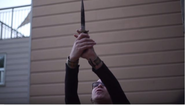 Co-Founder of the SFSU Occult club, Shea Bile,  holds ceremonial dagger during a protection ritual against Donald Trump in San Francisco on Sunday, April 30, 2017.