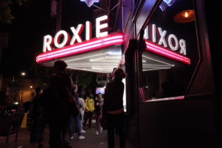 People walk past the Roxie Theater, in the Mission District, as the SF Latino Film Fest came to a close on Sunday, in San Francisco, on September 30, 2018. (Janett Perez/Xpress)