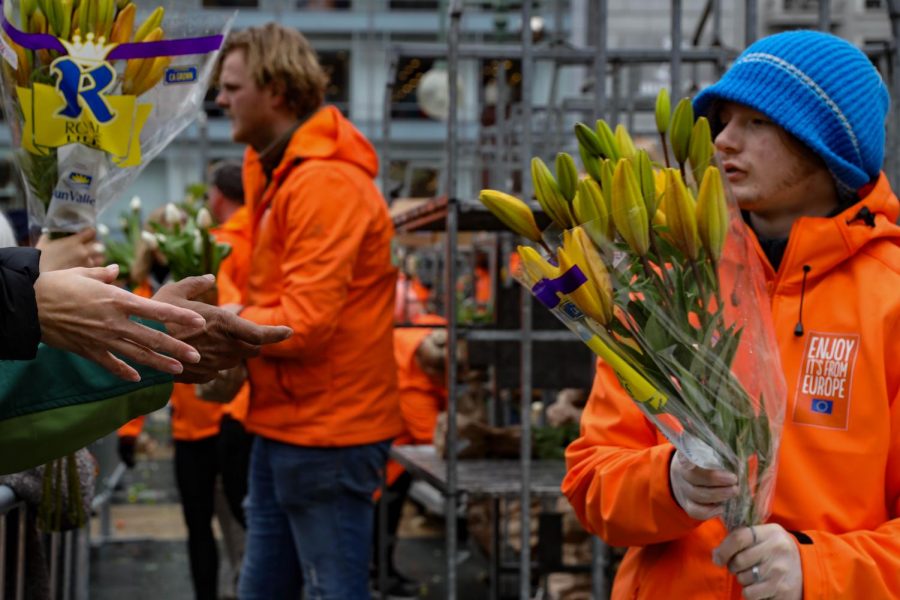 Tulips are stacked and handed out by volunteers in order to adhere to San Francisco health regulations spurred by recent COVID-19 developments during the American Tulip Festival at Union Square on March 7, 2020 (Photo by William Wendelman)