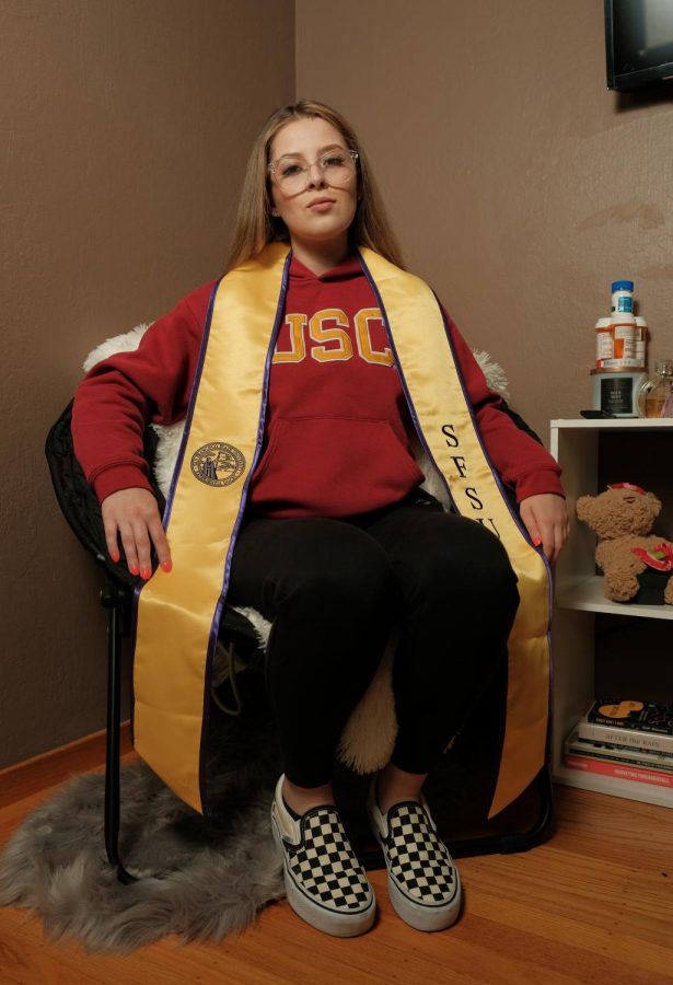 Alida Quinonez wears a USC hoodie and SFState stole. A lifetime of medications won’t keep me from pursuing her career, said Quinonez.