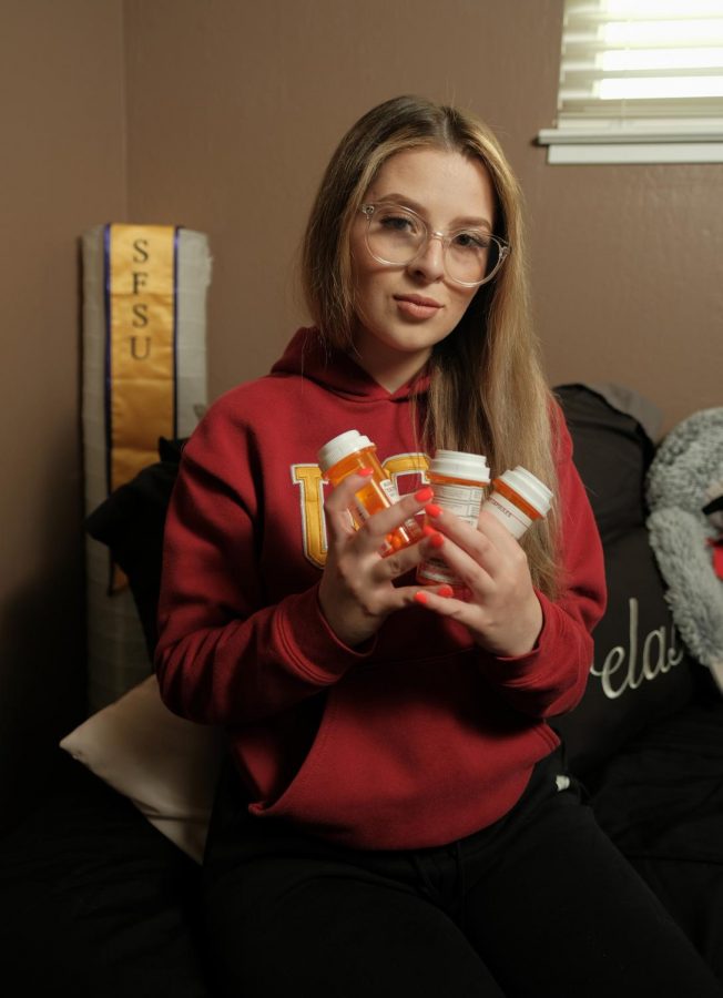 Alida Quinonez holds some of her daily medications that she takes at her home in Daly City, Calif. (Cameron Lee/ Xpress Magazine)