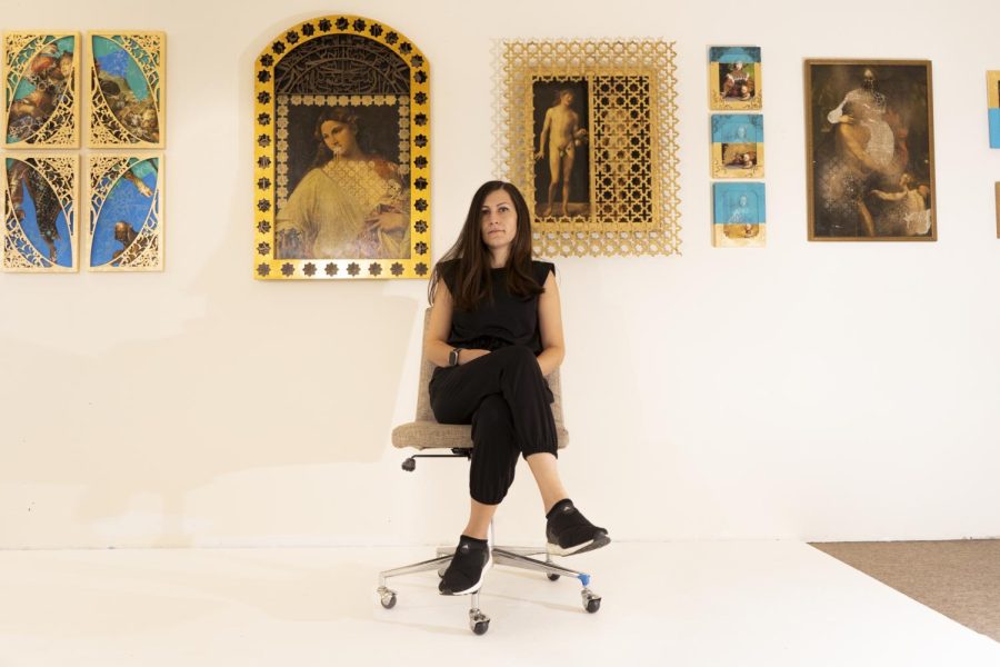 Kiana Honarmand poses for a portrait with her artwork at her studio in Palo Alto, Calif., on Nov. 4, 2021. Honarmand’s artwork uses colors, shapes and patterns that remind her of growing up in Iran. (Nicolas Cholula / Xpress Magazine)