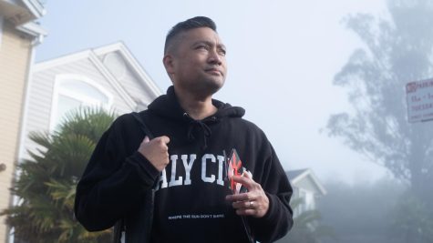 Mayor Rod Daus-Magbual sports some city spirit as he canvasses a Daly City neighborhood, hoping to drum up support for his reelection campaign.  (Miguel Francesco Carrion / Xpress Magazine) 