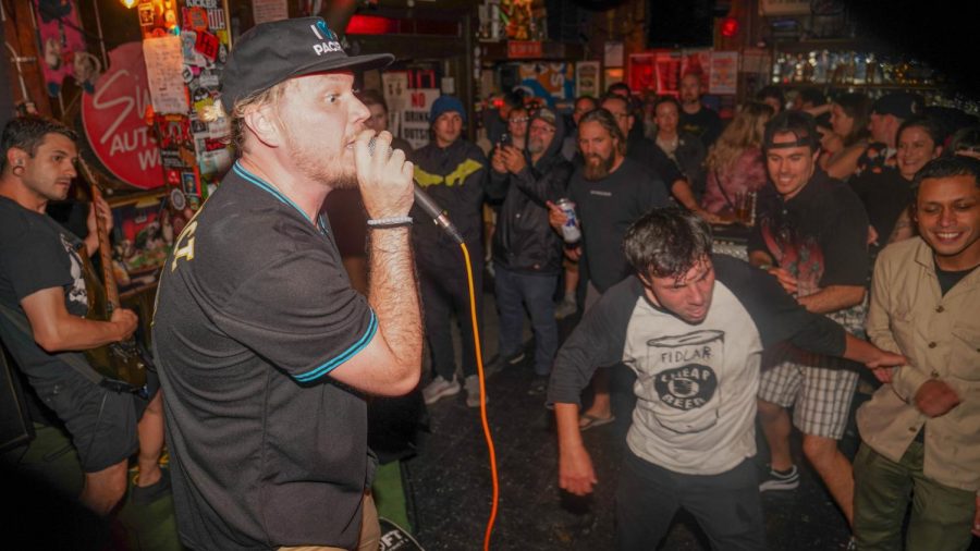 Robby Bancroft calls for movement from the crowd during a performance at Pacifica, Calif.’s Winter’s Tavern on Sept. 24, 2022. Bancroft later jumped in and joined them as they moshed and crowd surfed. (Joshua Carter / Xpress Magazine)
