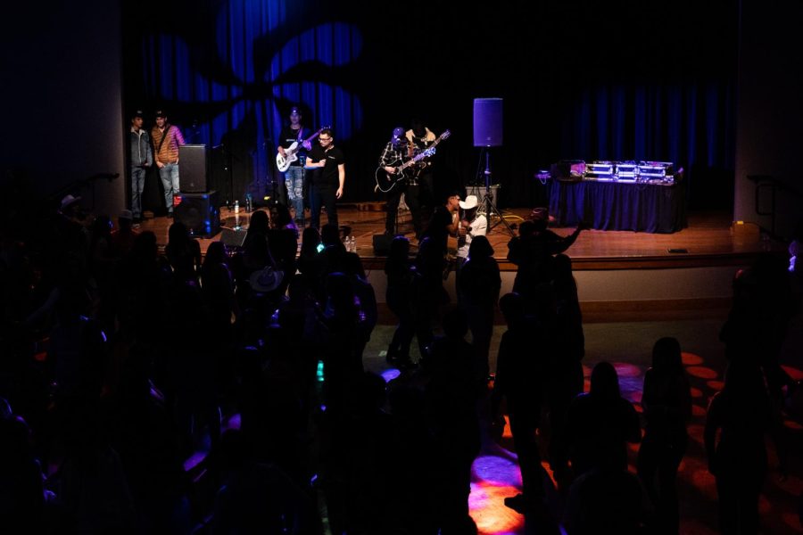 Band Nuevo Armamento plays a mixture of their own music and famous covers, such as Los Tucanes de Tijuana’s La Chona, on the stage of Jack Adams Hall within SF State’s Cesar Chavez Student Center for Banda Nite on Dec. 2, 2022. (Daniel Hernandez / Xpress Magazine)