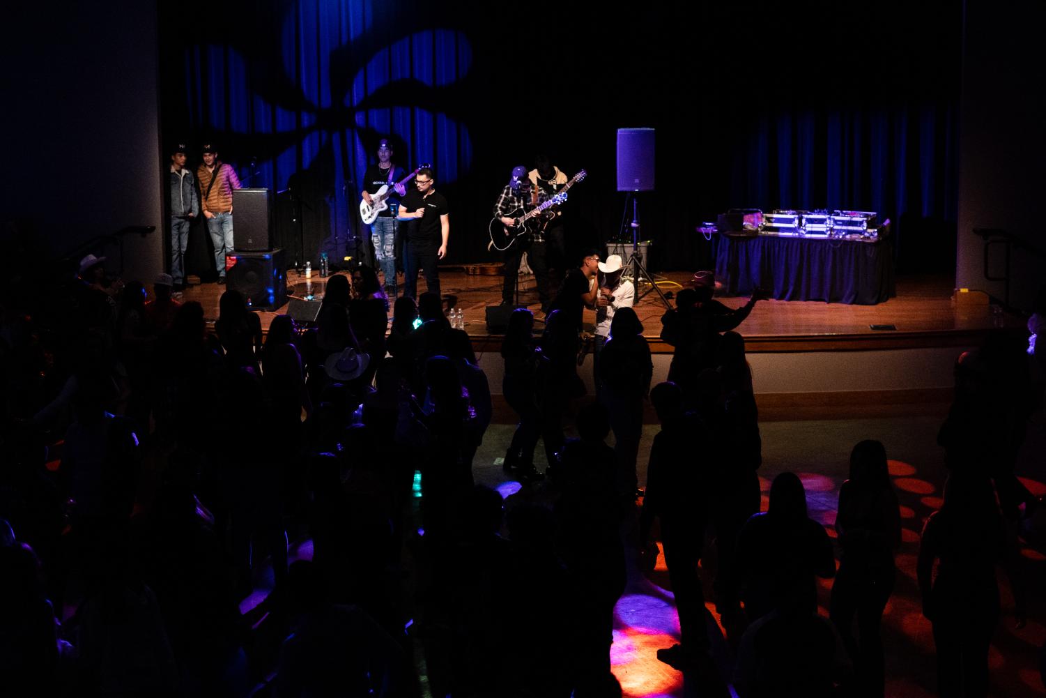 Band Nuevo Armamento plays a mixture of their own music and famous covers, such as Los Tucanes de Tijuana’s La Chona, on the stage of Jack Adams Hall within SF State’s Cesar Chavez Student Center for Banda Nite on Dec. 2, 2022. (Daniel Hernandez / Xpress Magazine)