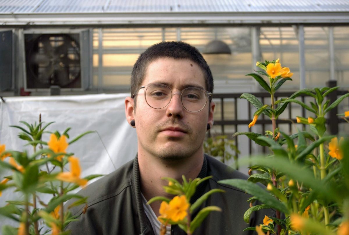 Elliot Levin, the greenhouse manager at SFSU, is seen near some
diplacus aurantiacus flowers, also known as near the SF State greenhouse on Aug. 30, 2023.
(Neal Wong/Xpress Magazine)

