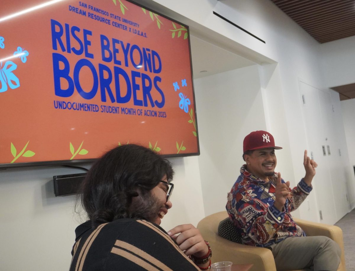 Yosimar Reyes shared creative writing advice with Oliver Elias Tinoco at a Q&A after Reyes presentation at the Cesar Chavez Student Center on Oct. 10, 2023. (Feven Mamo/Xpress Magazine)