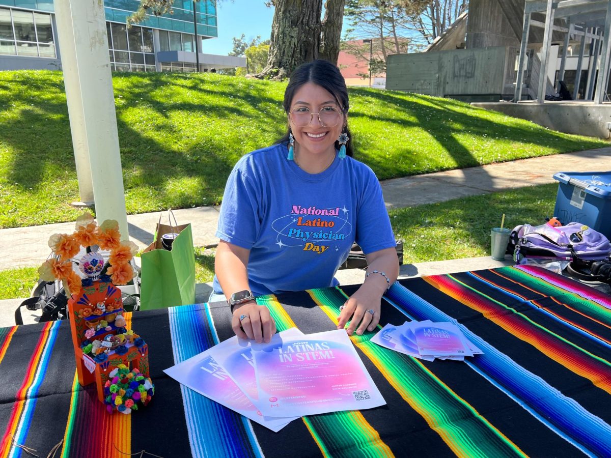As National Physician Latino Day approaches on Oct. 1, Viclarie Lozoya, a physiology major, sets up a table outside to advocate for students to join Latinas in STEM, an empowering science community that offers leadership and mentorship for college students. (Courtesy photo Viclarie Lozoya)