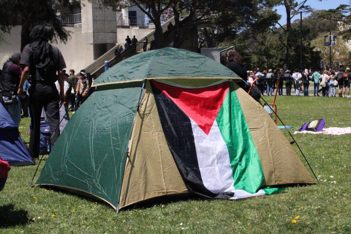 An erected tent decorated with a Palestinian flag at the encampment on the Quad. The encampment lasted three weeks, having started on April 29 and ending on May 15, after reaching an agreement for the university’s military divestment and investment transparency.  (David Ye / Xpress Magazine)