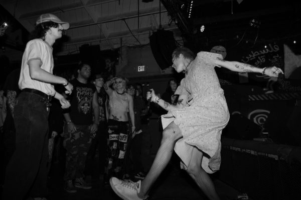 I’ve Never Been Here Before dances during one of her performances at 924 Gilman Street. Most of the other people in the picture are members of other bands that were performing that day, including Snallygaster and Nick Pants.