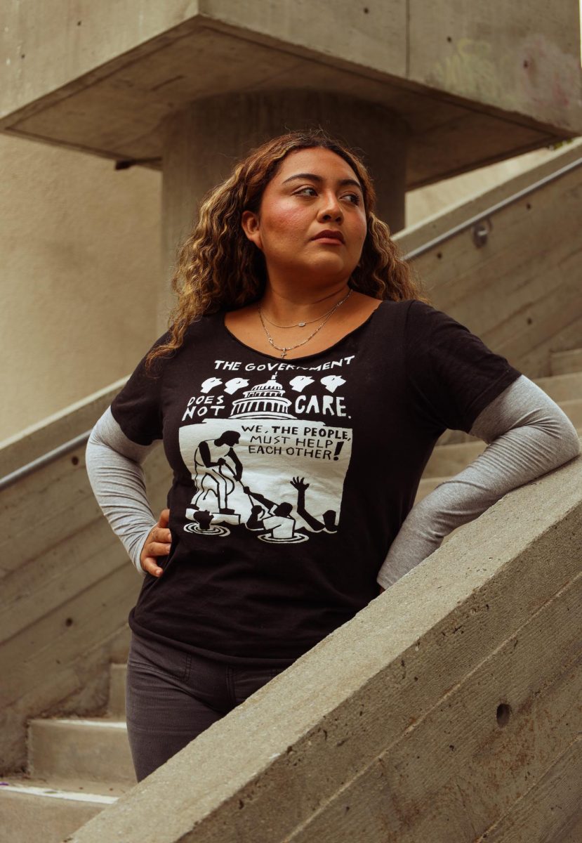 President of the Young Democratic Socialists of America Michelle Martinez poses for a portrait on the stairs by the Cesar Chavez student center at San Francisco on Sept. 25, 2024. (Gabriel Carver / Xpress)