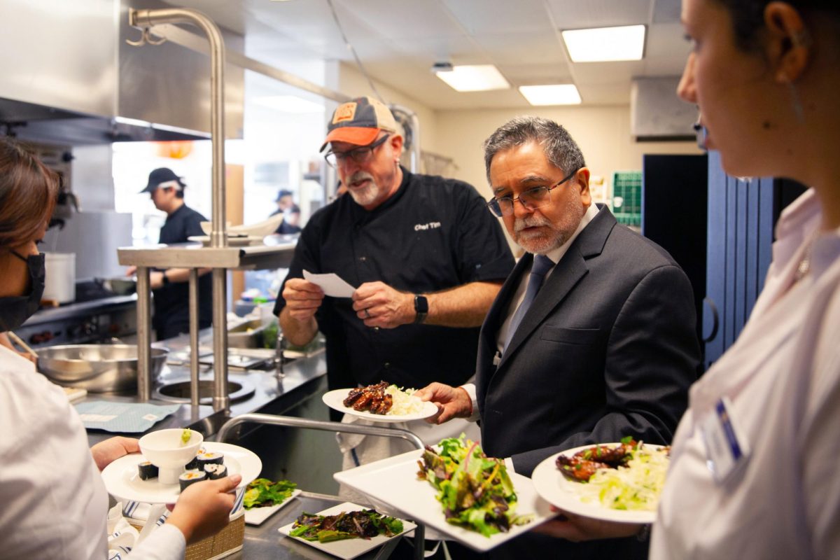 Chef Tim Shaw (center) and Colin Johnson (right) inspect orders and dishes at The Vista Room. (Jesus Arriaga / Xpress Magazine) 