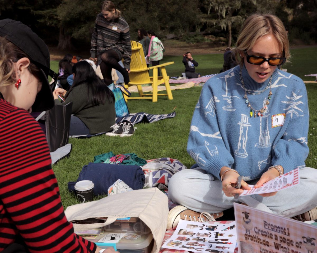 Lily Layman (right) works on a junk journal at the Crafts and Gratitude: Pages of Thanks event at Peacock Meadow in San Francisco, Calif. on Sunday, Nov. 17, 2024. (Jesus Arriaga / Xpress Magazine)