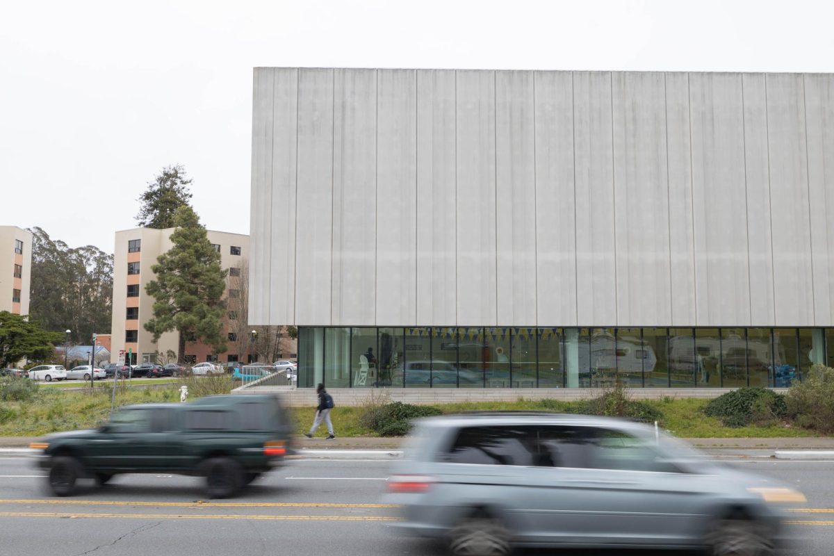 Cars zoom along Lake Merced Boulevard outside Mashouf Wellness Center. With construction completed in 2017, the state-of-the-art athletic facility cost SF State $86.5 million to complete, and an additional $50,000 for its Leadership in Energy and Environment Design (LEED) Platinum certification. (Seamus Geoghegan / Xpress Magazine)