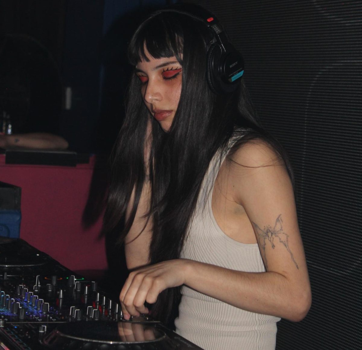 erika mid-set as she DJs. (AJ Voorheis/ Xpress Magazine) 