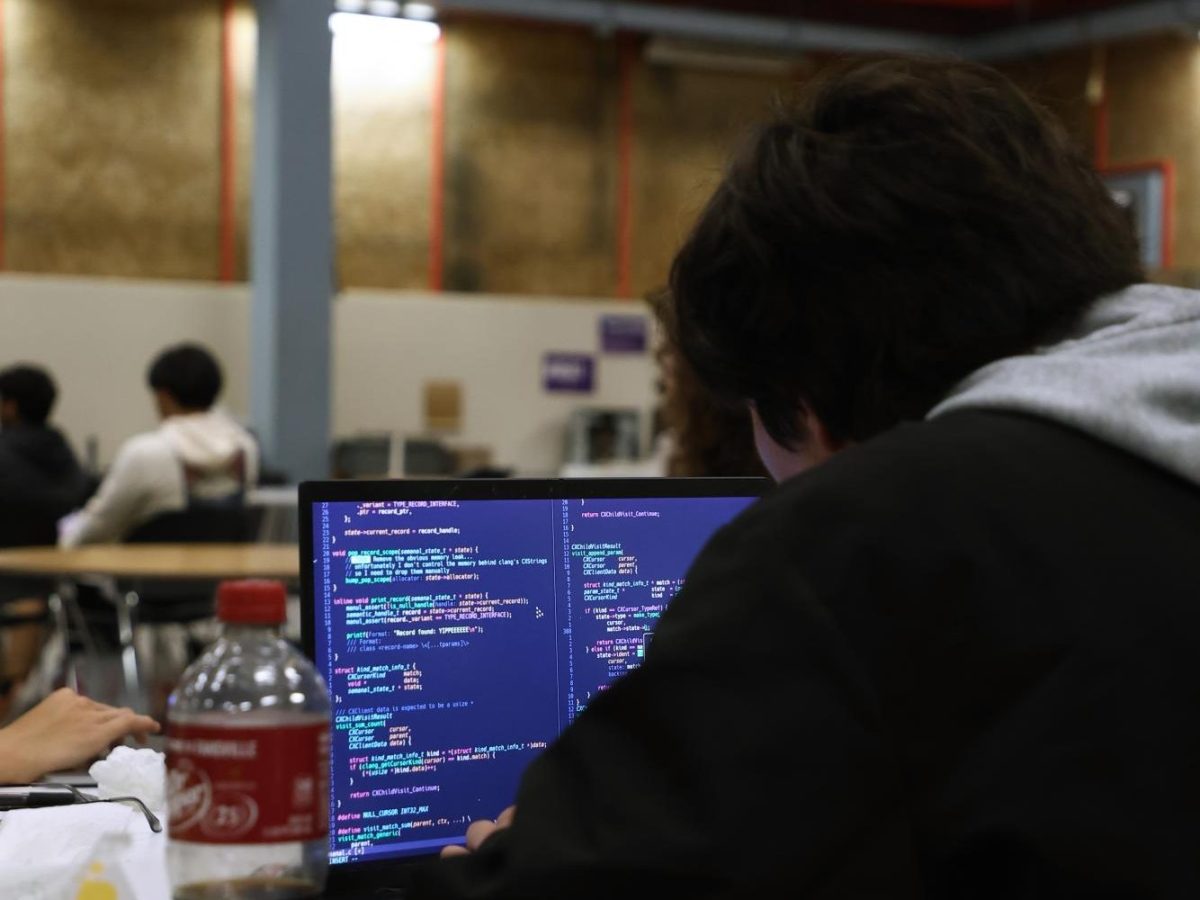 A Game Dev member Aaron works on some coding for “TheAtlasEngine” during a club meeting on Thursday Sept. 25, 2025. (Vanden Harris / Xpress Magazine)