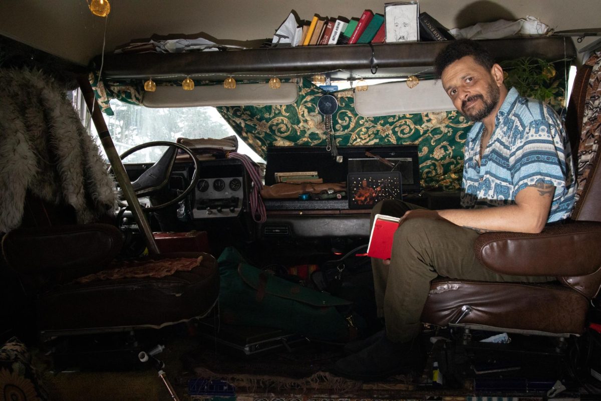 Mohamed Ali poses for a photo inside his RV on Sept. 25, 2025 in Daly City.  (Jolie Willson / Xpress Magazine)