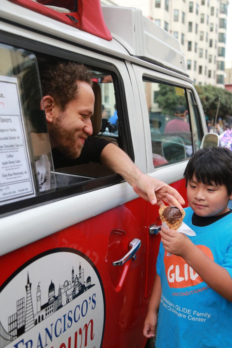 Saadi Halil, co-owner of San Francisco’s Hometown Creamery, and known for their “completely from scratch” ice cream, hands out cone after cone to children eagerly waiting their turn. (Hannah Clark-Nixon / Xpress Magazine)