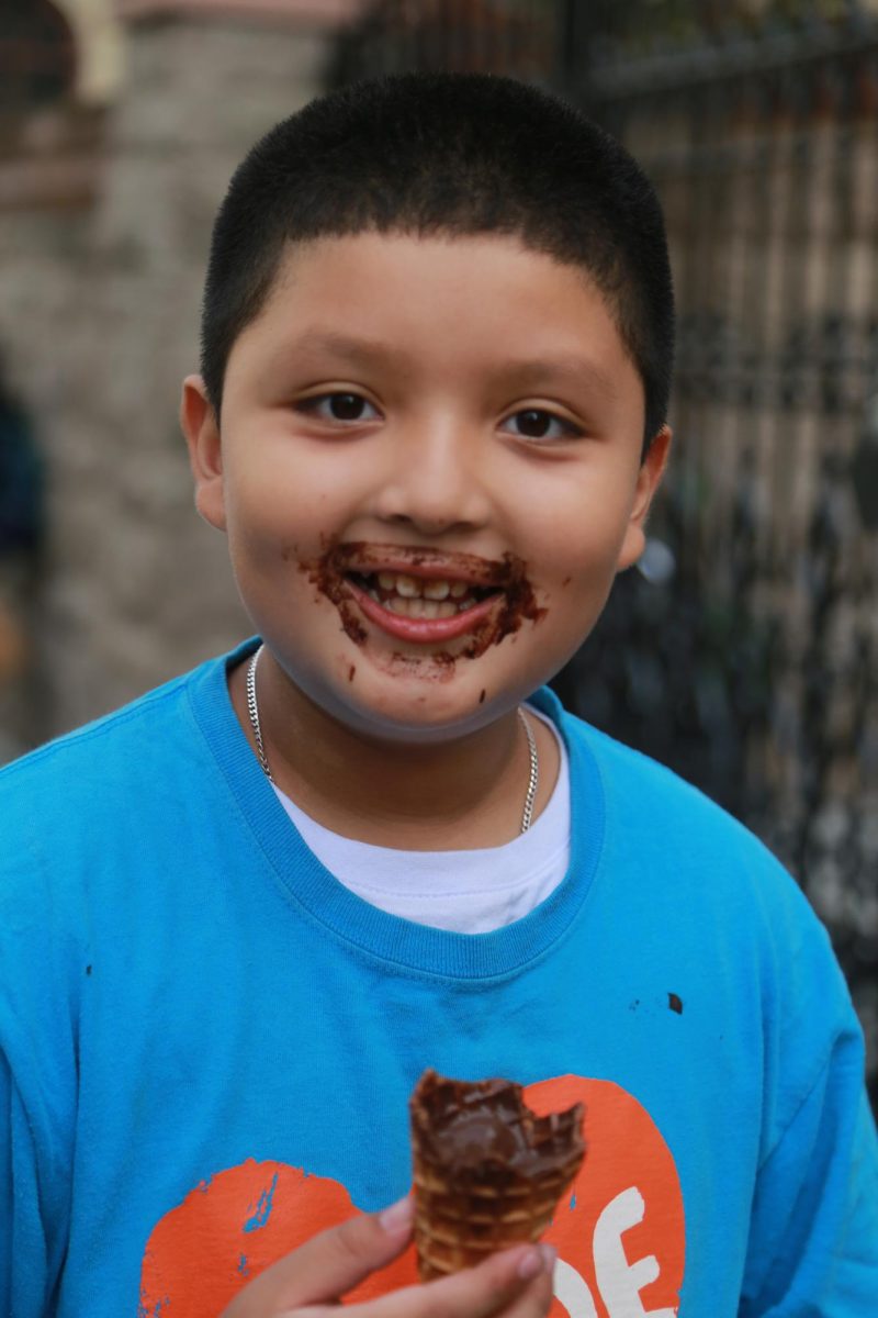 Dylan, from Glide’s FYCC finishes his last bite of chocolate ice cream. (Hannah Clark-Nixon / Xpress Magazine)
