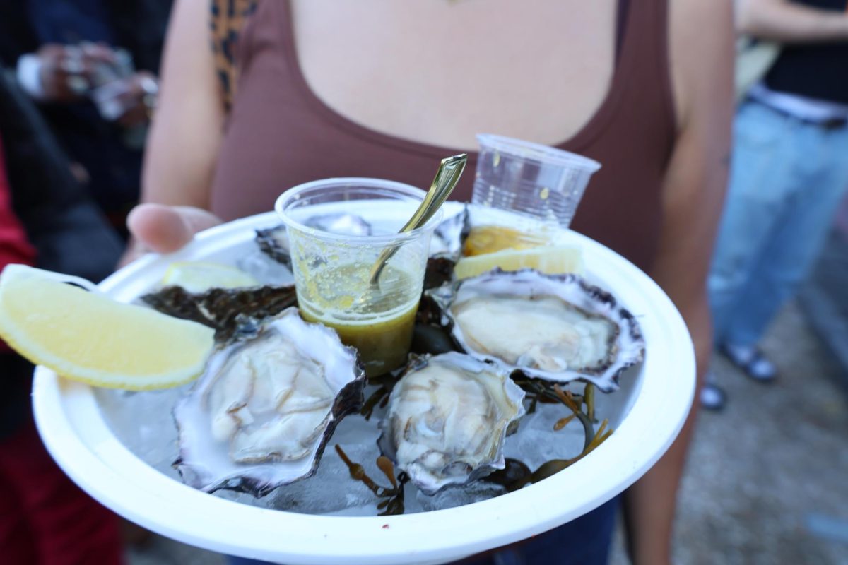 Founded by mother-daughter duo Ofelia and Reyna Maldonado, Las Guerreras shucks and serves Tomales Bay oysters on ice at the SF Street Food Festival on Saturday, Nov. 8, 2025.  Las Guerreras serves coastal food originating in Guerrero, Mexico at their booth at Oakland’s historic Swan’s Market. (Olivia Mendez / Xpress Magazine)