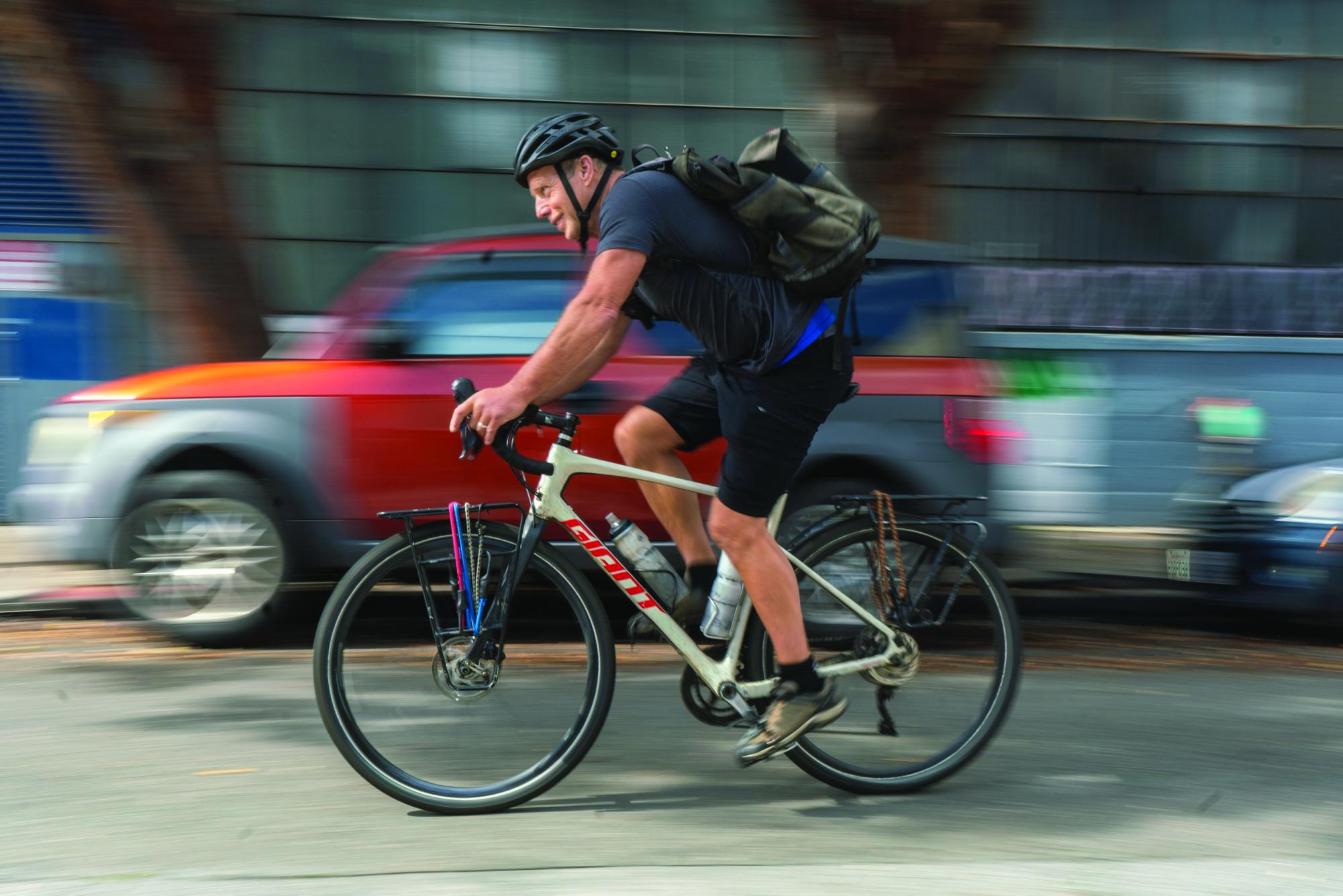 Stephan Kizziah rides his bike in the South of Market district of San Francisco. He’s been a bike messenger since his early high school years. (Ryo Kojima / Xpress Magazine)