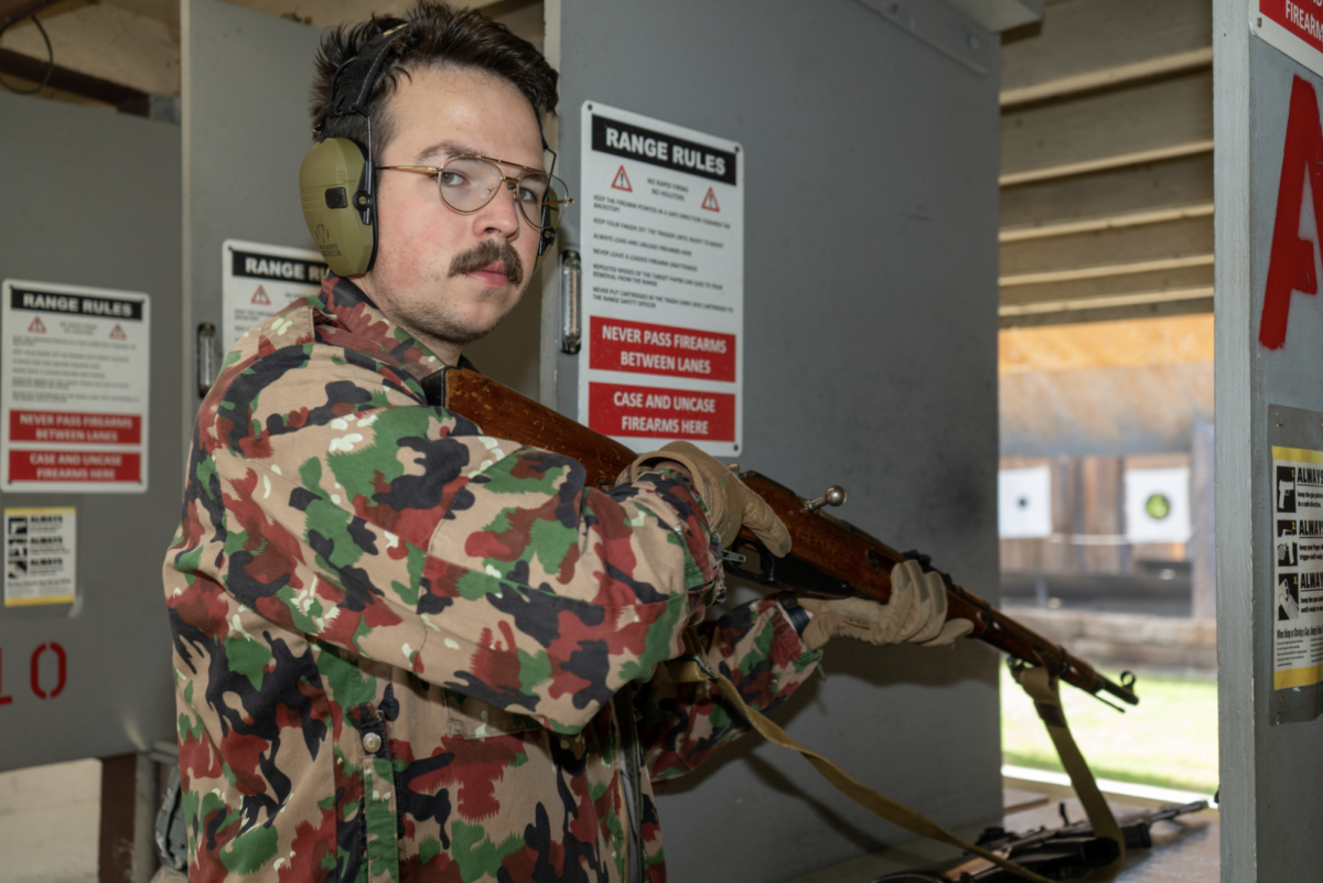 Firearm owner and third year psychology major at SF State, Daniel Marnach and his bolt-action rifle at the San Leandro Gun Rifle & Pistol Range. (Ryo Kojima / Xpress Magazine)