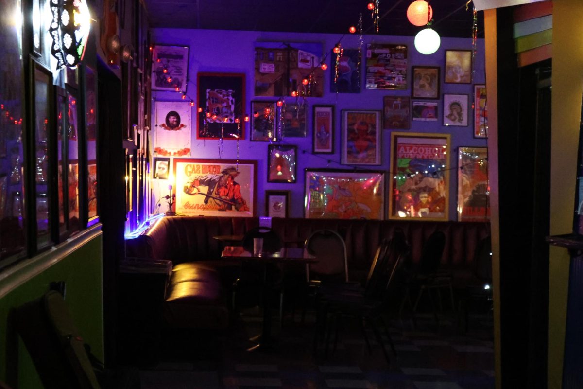 A variety of framed posters and paintings line the walls of Bottom of the Hill, a venue space in San Francisco. (Gwen Murray /  Xpress Magazine )