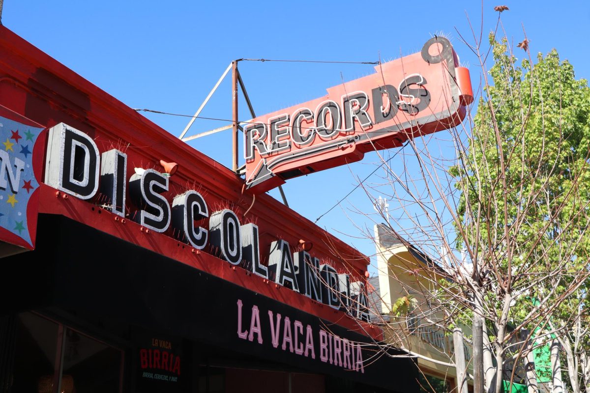 The former record store sign for Discolandia records in the Mission District. The store officially closed its doors in 2011 and a restaurant now takes its place on May 10, 2026. (Eliza Arthur / Xpress Magazine)