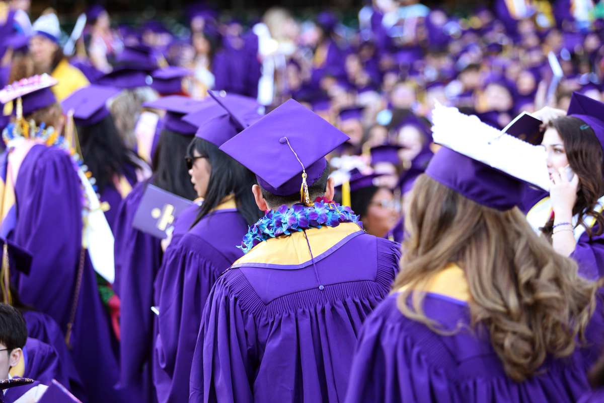 This year, 4,300 students will graduate at Oracle Park and none of their names will be read during the ceremony. But, their image will be shown on a four-way split jumbotron as they pose in front of a backdrop. (Braelyn Furse / Xpress Magazine)
